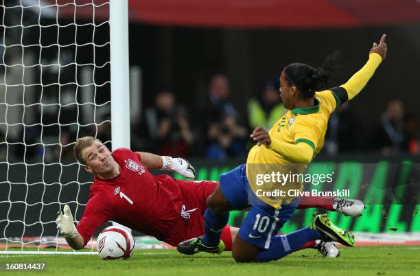Joe Hart of England saves a penalty from Ronaldinho of Brazil during the International friendly between England and Brazil at Wembley Stadium on...