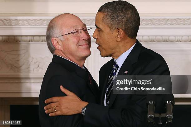 Interior Secretary Ken Salazar embraces President Barack Obama after Obama announced he is nominating REI Chief Executive Officer Sally Jewell to...