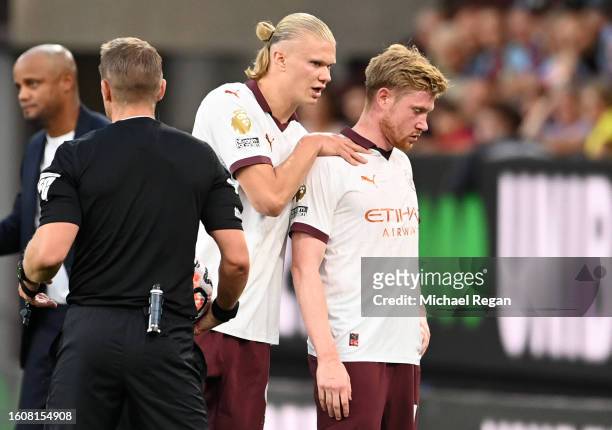 Erling Haaland of Manchester City consoles teammate Kevin De Bruyne as he is substituted after sustaining an injury during the Premier League match...