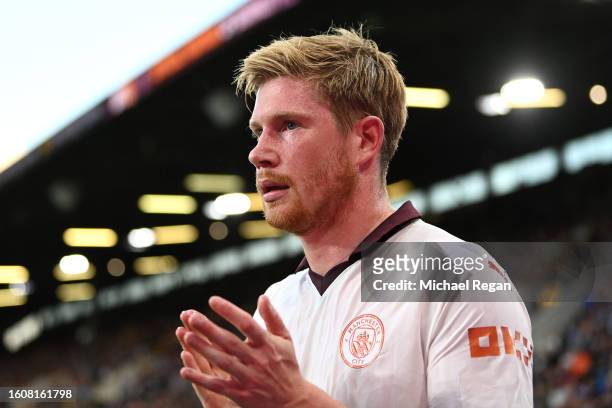 Kevin De Bruyne of Manchester City reacts after sustaining an injury during the Premier League match between Burnley FC and Manchester City at Turf...