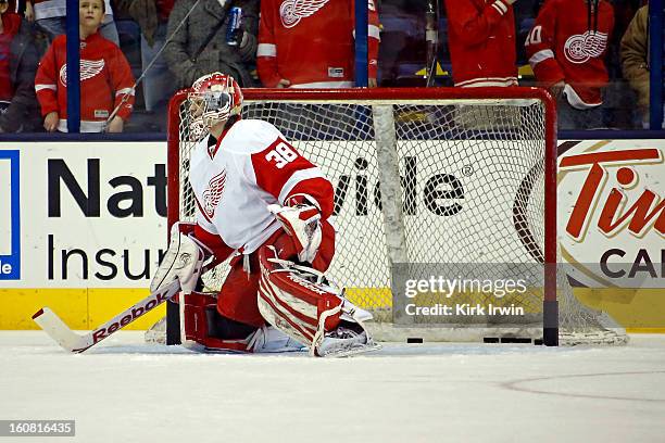 Tom McCollum of the Detroit Red Wings warms up prior to the start of the game against the Columbus Blue Jackets on February 2, 2013 at Nationwide...