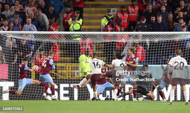 Rodri of Manchester City scores the team's third goal past James Trafford of Burnley during the Premier League match between Burnley FC and...