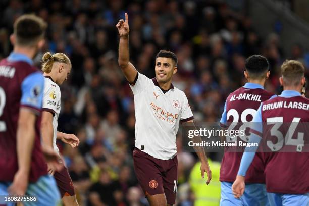 Rodri of Manchester City celebrates after scoring the team's third goal during the Premier League match between Burnley FC and Manchester City at...