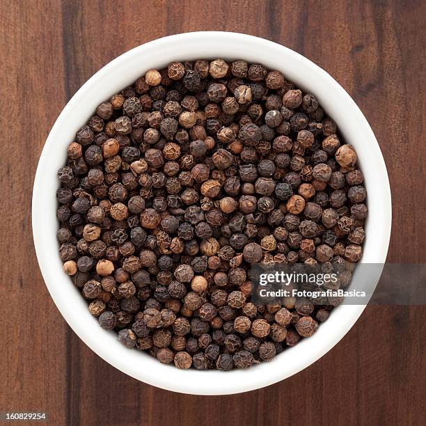 black peppercorns - black peppercorn stock pictures, royalty-free photos & images