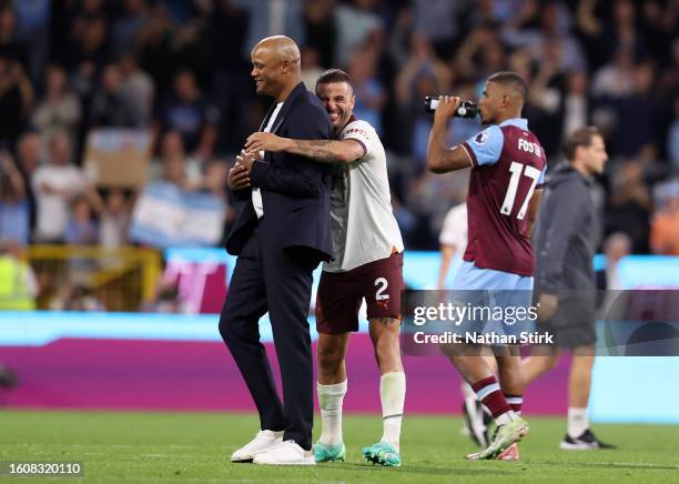 Vincent Kompany, Manager of Burnley, is embraced by Kyle Walker of Manchester City after the Premier League match between Burnley FC and Manchester...