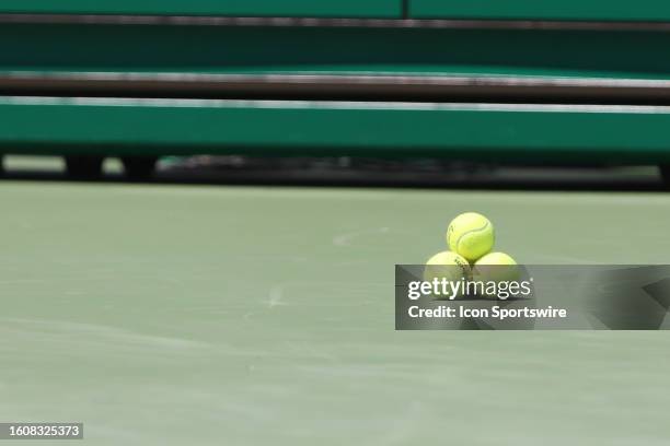 Tennis balls sit on the court during the fourth round at the Western & Southern Open at Lindner Family Tennis Center on August 18, 2023 in Mason,...