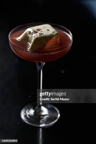 red cocktail with amazing decoration - stock photo - tangerine martini stock pictures, royalty-free photos & images