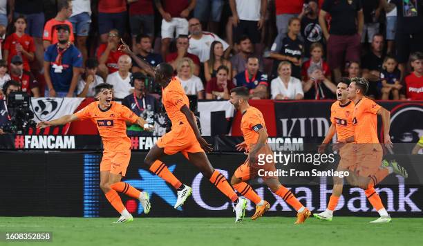 Mouctar Diakhaby of Valencia celebrates with teammates after scoring the team's first goal during the LaLiga EA Sports match between Sevilla FC and...