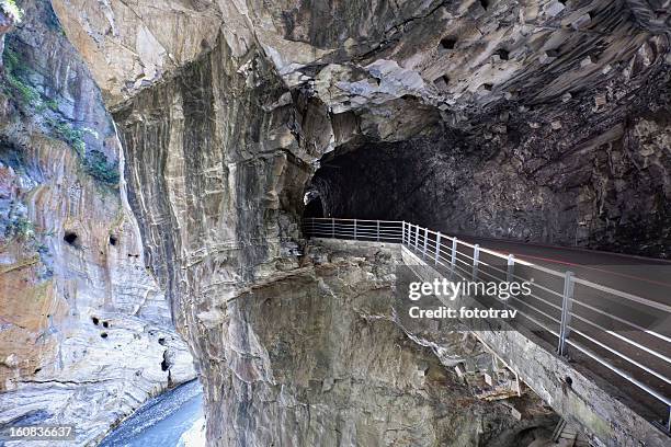 road going through the cliffs of taroko national park, taiwan - taroko gorge national park stock pictures, royalty-free photos & images