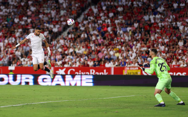 Yousseff En-Nesyri of Sevilla scores the team's first goal during the LaLiga EA Sports match between Sevilla FC and Valencia CF at on August 11, 2023...