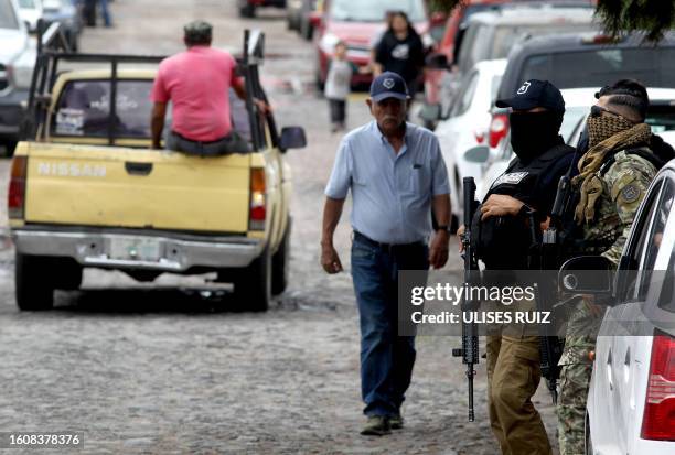 Graphic content / Ministerial police officers are deployed in Lagos de Moreno, Jalisco State, Mexico, on August 18 following the disappearance of...