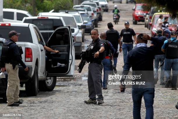 Graphic content / Ministerial police officers are deployed in Lagos de Moreno, Jalisco State, Mexico, on August 18 following the disappearance of...