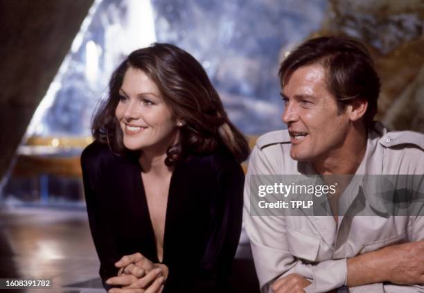 American actress Lois Chiles, is Holly Goodhead, and English actor Roger Moore , is James Bond, during the filming of the 1979 James Bond spy movie,...