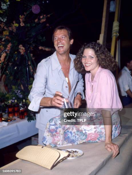 English actor Roger Moore , is James Bond, and American actress Lois Chiles, is Holly Goodhead, during the filming of the 1979 James Bond spy movie,...