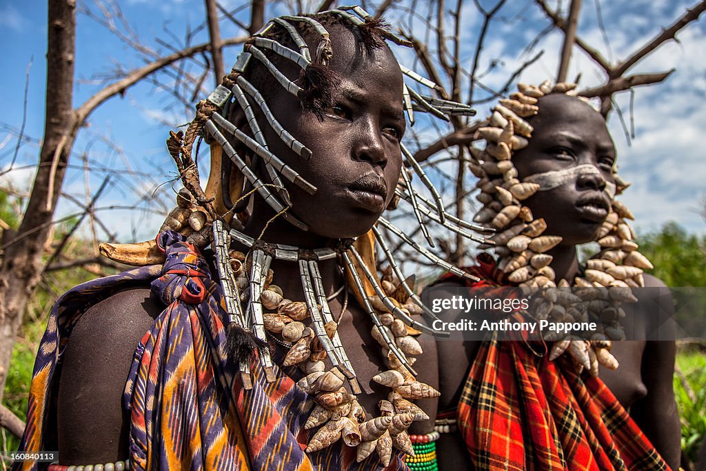 Young boys of the tribe Mursi with necklaces