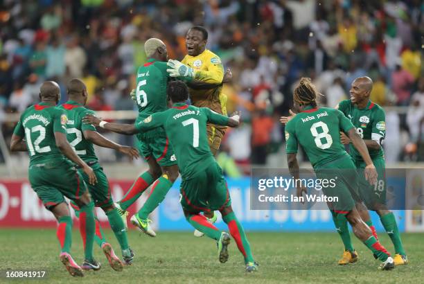 Goalkeeper Diakite Daouda of Burkina Faso celebrates victory with team-mates after saving a penalty in a shootout during the 2013 Africa Cup of...