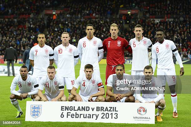 England's starting eleven Theo Walcott, Wayne Rooney, Chris Smalling, Joe Hart, Gary Cahill and Danny Welbeck and Ashley Cole, Tom Cleverley, Steven...