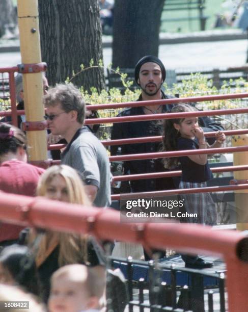 Lourdes Ciccone Leon, right, plays in Central Park under the watchful eye of her father Carlos Leon in the fall of 2000 in New York City. Lourdes is...