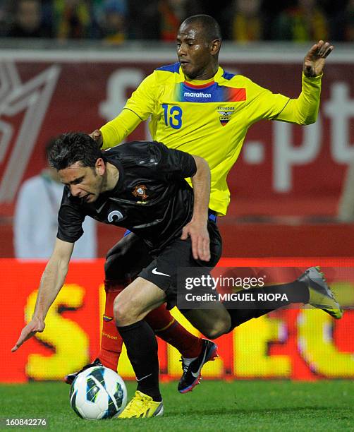 Ecuador's defender Oscar Bagui vies with Portugal's forward Helder Postiga during the international friendly football match Portugal vs Ecuador at...