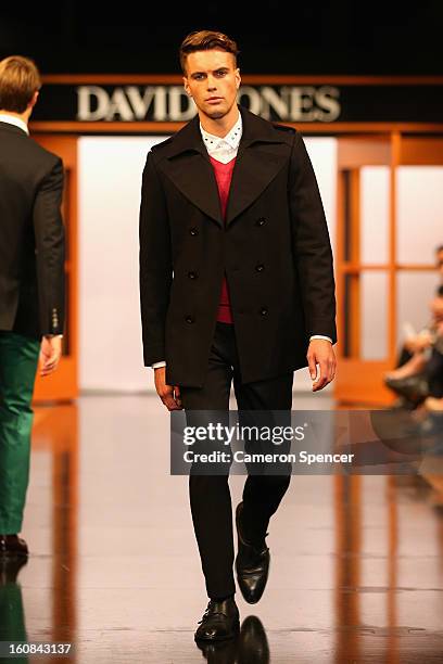 Model showcases designs by Calibre on the runway during the David Jones A/W 2013 Season Launch at David Jones Castlereagh Street on February 6, 2013...