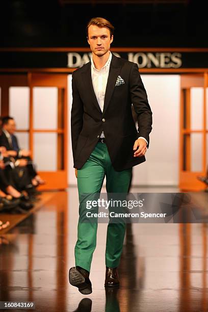 Model showcases designs by Calibre on the runway during the David Jones A/W 2013 Season Launch at David Jones Castlereagh Street on February 6, 2013...