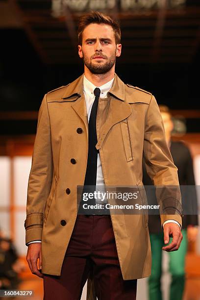 Model showcases designs by Calibre on the runway during the David Jones A/W 2013 Season Launch at David Jones Castlereagh Street on February 6, 2013...