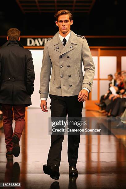 Model showcases designs by Calibre on the runway during the David Jones A/W 2013 Season Launch at David Jones Castlereagh Street on February 6, 2013...