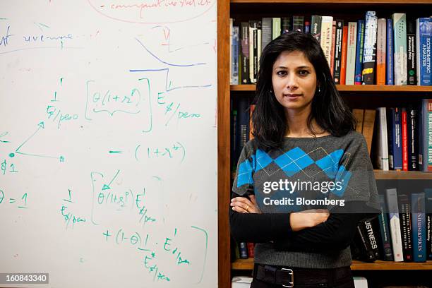 Gita Gopinath, professor of economics at Harvard University, poses for a portrait in her office on campus in Cambridge, Massachusetts, U.S., in...