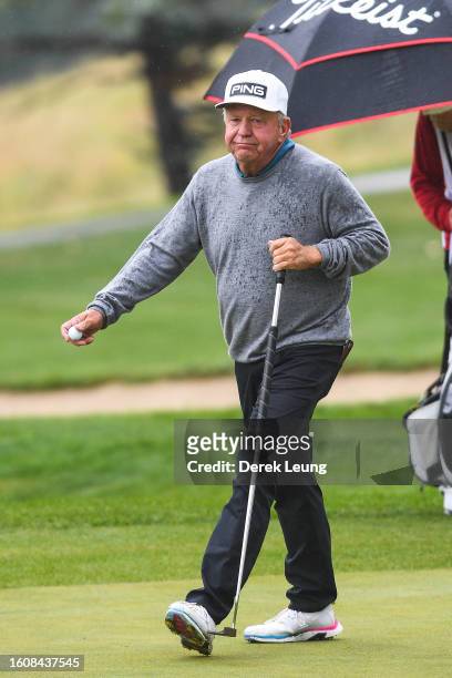 Billy Mayfair of the United States, who finished the day third on the leaderboard at -5, walks hole nine on day one of the Shaw Charity Classic at...