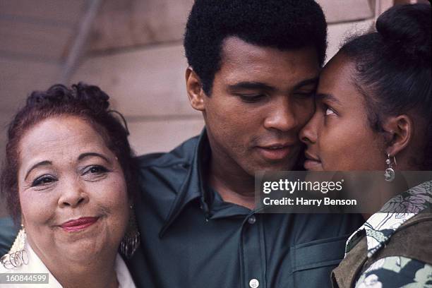 Former heavyweight champion Muhammad Ali, mother Odessa O'Grady Clay and second wife, Belinda Boyd are photographed in 1976 in San Juan, Puerto Rico.