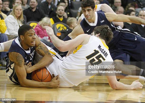 Guard Jermaine Marshall of the Penn State Nittany Lions fights for the ball during the second half with forward Zach McCabe of the Iowa Hawkeyes on...