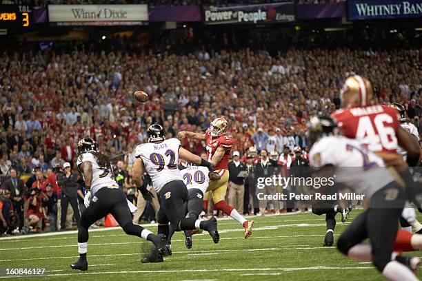 Super Bowl XLVII: San Francisco 49ers QB Colin Kaepernick in action, making pass under pressure vs Baltimore Ravens Ed Reed at Mercedes-Benz...