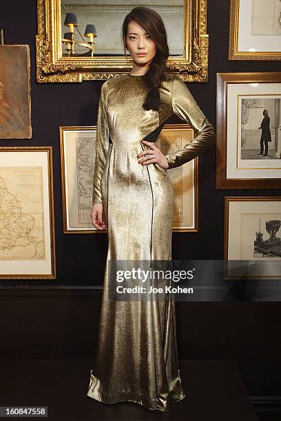 Model poses for a photo during the Veronica Beard fall 2013 presentation during Mercedes-Benz Fashion Week at Bill's on February 6, 2013 in New York...