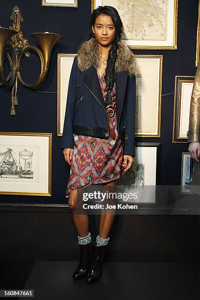 Model poses for a photo during the Veronica Beard fall 2013 presentation during Mercedes-Benz Fashion Week at Bill's on February 6, 2013 in New York...