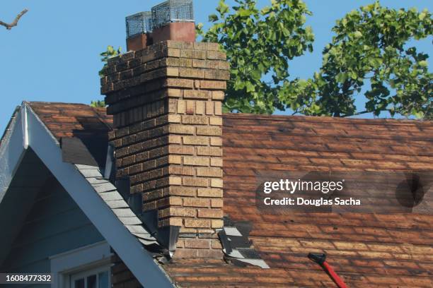 bare roof after shingles have been removed - chimney stock pictures, royalty-free photos & images