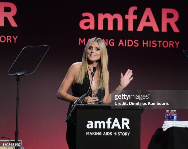 Heidi Klum speaks onstage at the amfAR New York Gala to kick off Fall 2013 Fashion Week at Cipriani Wall Street on February 6, 2013 in New York City.