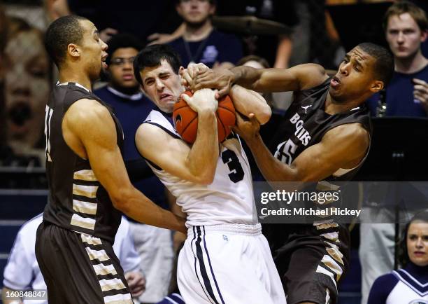 Demitrius Conger of the St. Bonaventure Bonnies and Michael Davenport of the St. Bonaventure Bonnies battle with Alex Barlow of the Butler Bulldogs...