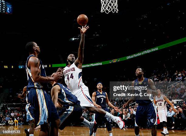 Austin Daye of the Memphis Grizzlies draws an offensive foul from Ivan Johnson of the Atlanta Hawks at Philips Arena on February 6, 2013 in Atlanta,...