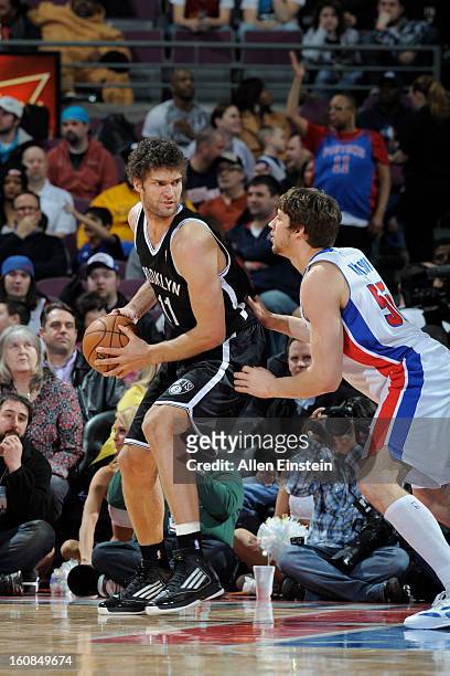 Brook Lopez of the Brooklyn Nets controls the ball against Viacheslav Kravtsov of the Detroit Pistons on February 6, 2013 at The Palace of Auburn...