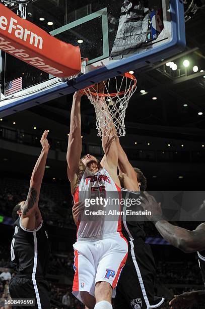 Viacheslav Kravtsov of the Detroit Pistons dunks the ball against the Brooklyn Nets on February 6, 2013 at The Palace of Auburn Hills in Auburn...