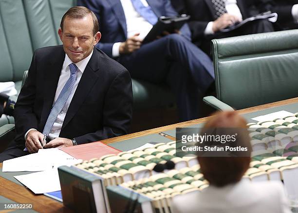 Oppostion leader Tony Abbott looks at Prime Minister Julia Gillard during House of Representatives question time at Parliament House on February 7,...