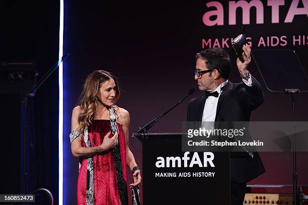 Actress Sarah Jessica Parker and designer Kenneth Cole speak onstage at the amfAR New York Gala to kick off Fall 2013 Fashion Week at Cipriani Wall...