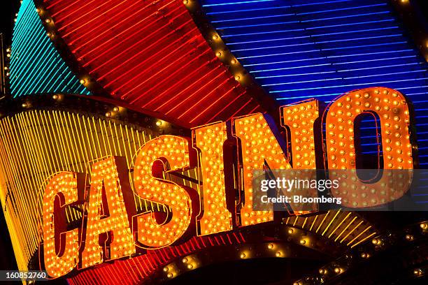 The Casino Lisboa, operated by SJM Holdings Ltd., stands illuminated at night in Macau, China, on Wednesday, Feb. 6, 2013. Casino industry revenue in...