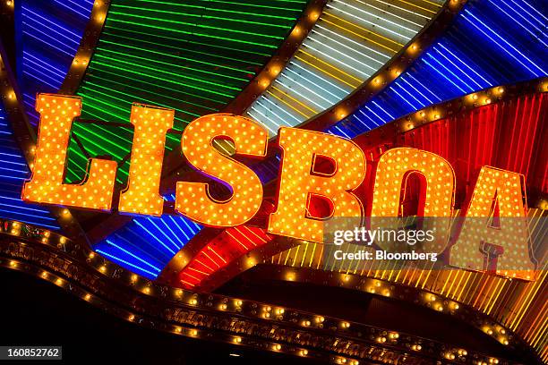 The Casino Lisboa, operated by SJM Holdings Ltd., stands illuminated at night in Macau, China, on Wednesday, Feb. 6, 2013. Casino industry revenue in...