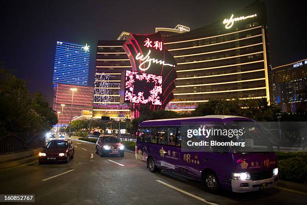 Vehicles drive past the Wynn Macau casino resort, operated by Wynn Resorts Ltd., in Macau, China, on Wednesday, Feb. 6, 2013. Casino industry revenue...