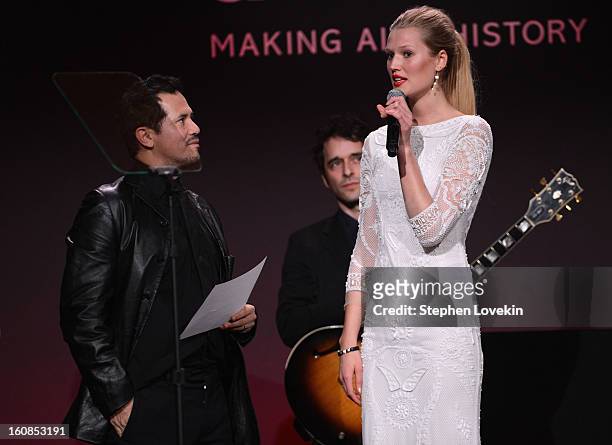 John Leguizamo and Toni Garrn speak onstage at the amfAR New York Gala to kick off Fall 2013 Fashion Week at Cipriani Wall Street on February 6, 2013...