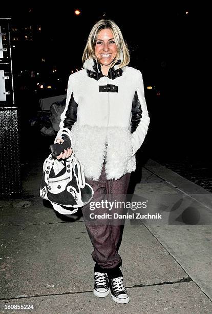 Gia Marie Ghezzi, DMM at Intermix, seen outside the J. Brand presentation wearing Hotel Particulier jacket, Veronica Beard trousers and a Balenciaga...