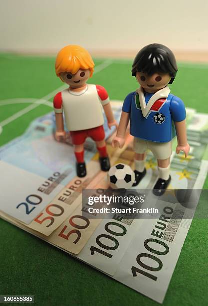 This photo illustration shows Euro bank notes and a table soccer game on February 6, 2013 in Hamburg, Germany. Europol have uncovered evidence that...