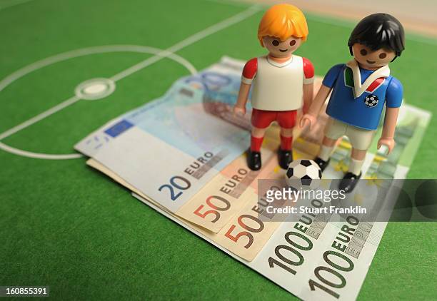 This photo illustration shows Euro bank notes and a table soccer game on February 6, 2013 in Hamburg, Germany. Europol have uncovered evidence that...