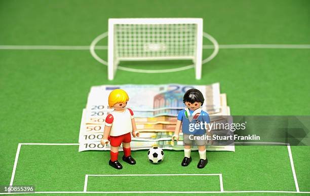 This photo illustration shows Euro bank notes and a table soccer game on February 6, 2013 in Hamburg, Germany. Europol have uncovered evidence that...